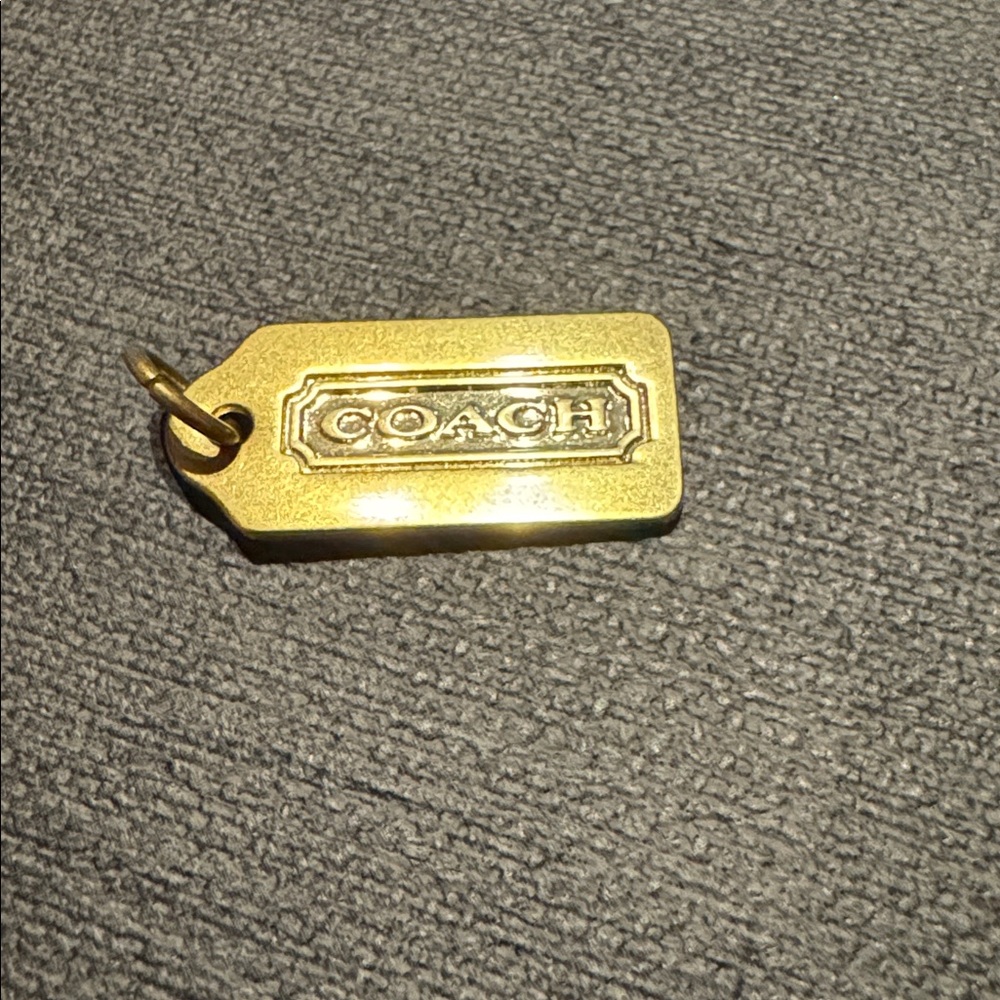 Coach GOLD BRASS color hang tag
